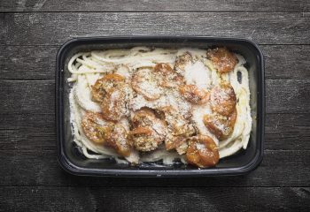 Zesty Tuscan Chicken over Garlic Parmesan Pasta